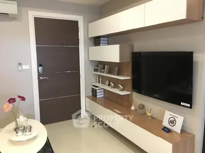 Modern living room with sleek TV unit and stylish decor