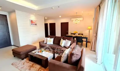 Spacious living room with elegant decor and dining area in modern apartment