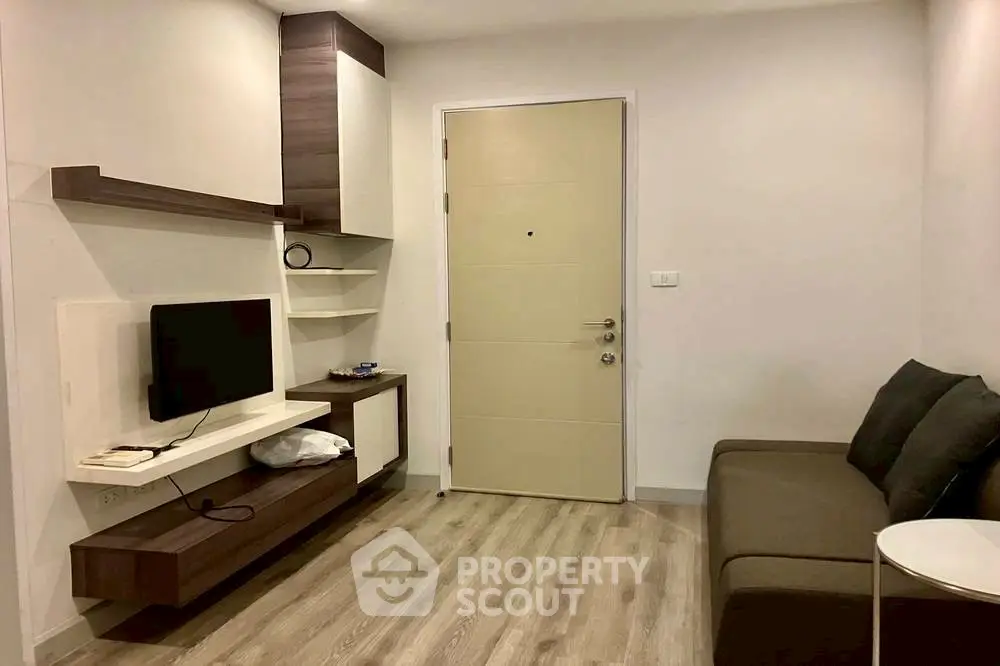 Modern living room with sleek furniture and wooden flooring