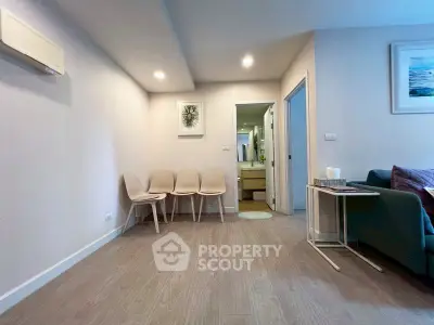 Modern living room with minimalist decor and wooden flooring