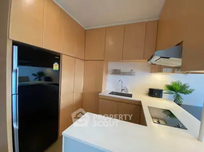Modern kitchen with sleek cabinetry and built-in appliances
