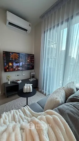 Cozy living room with modern decor and large window view