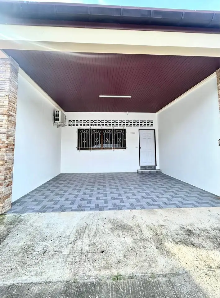 Spacious covered parking area with tiled flooring and modern design