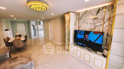 Luxurious living room with marble accents and elegant dining area