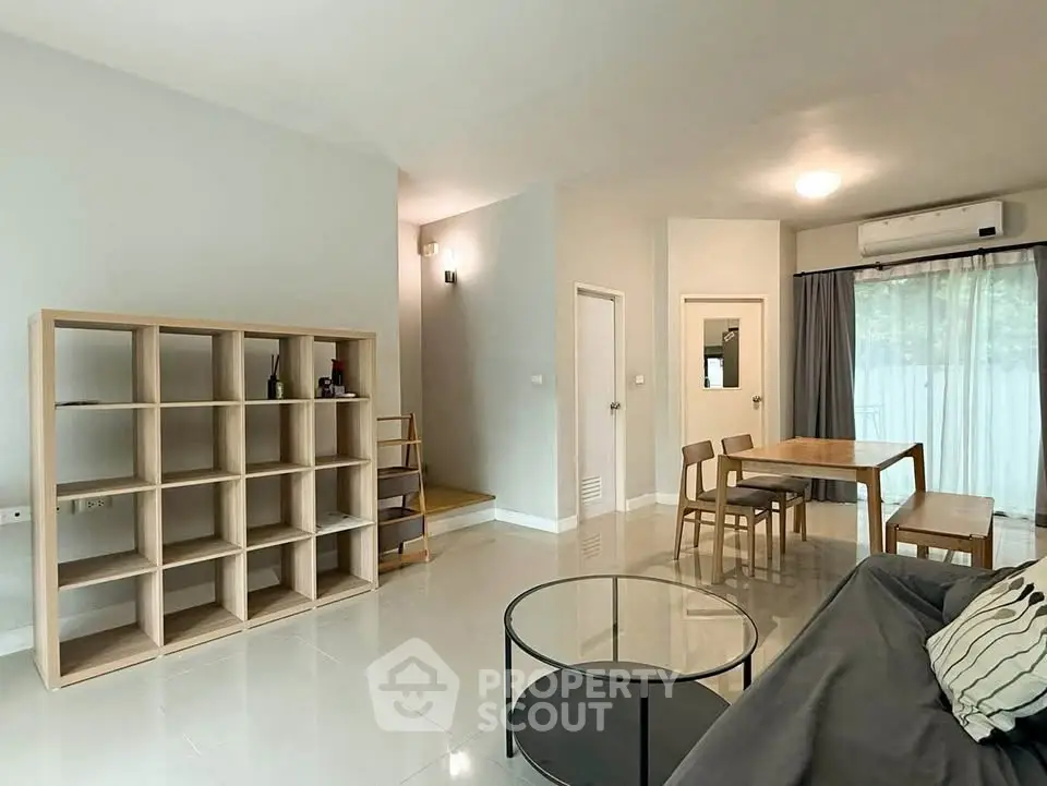 Spacious modern living room with minimalist furniture and natural light