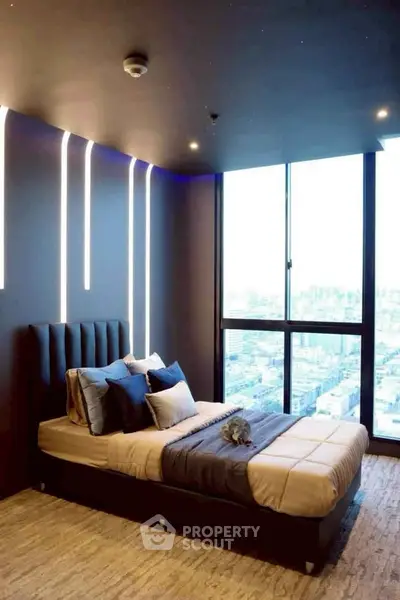 Luxurious modern bedroom with stunning city view and ambient lighting.