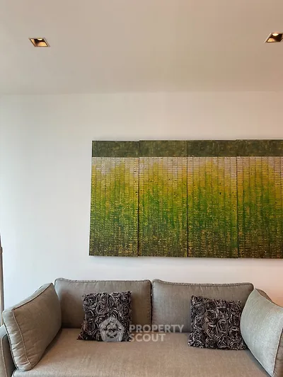 Modern living room with stylish sofa and abstract wall art