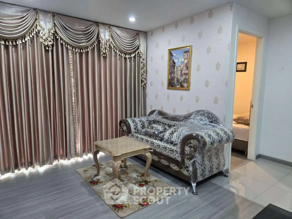 Luxurious living room with elegant drapes and ornate sofa, perfect for sophisticated living.