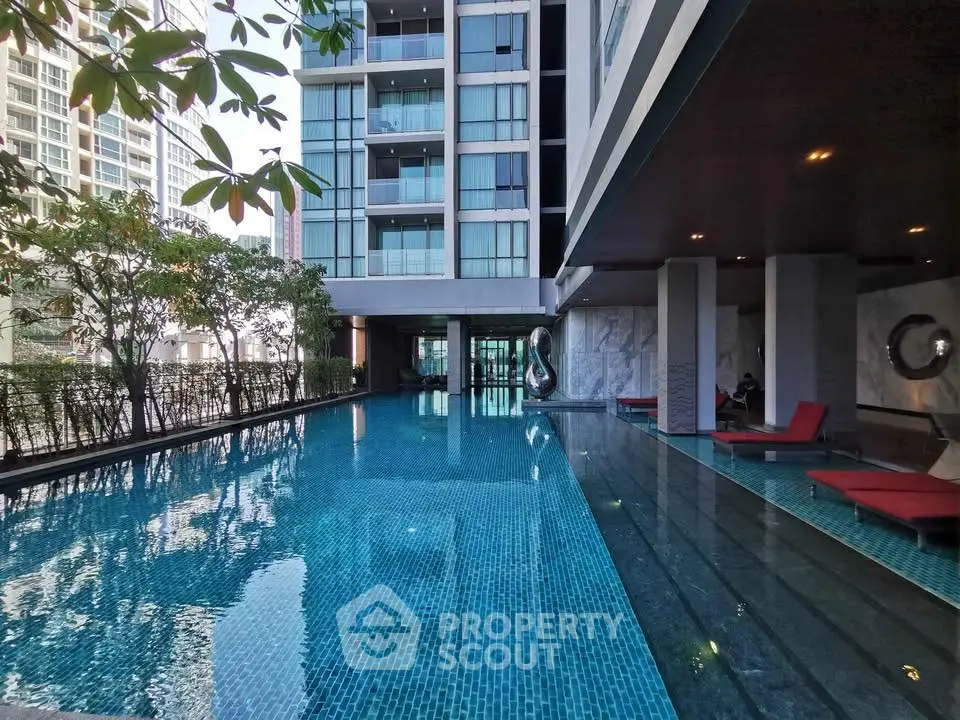 Luxurious condominium with stunning poolside view and modern architecture.
