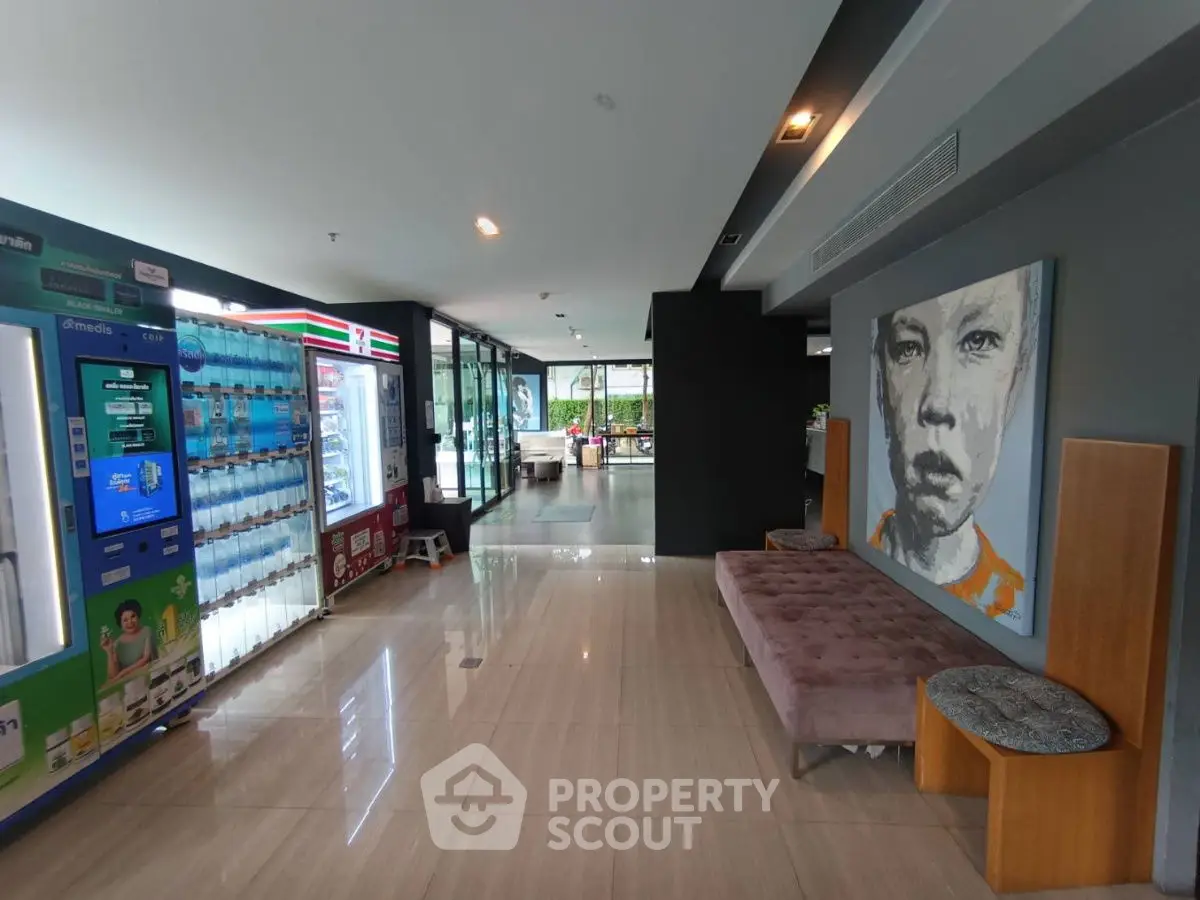 Modern building entrance with vending machines and contemporary art