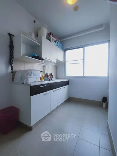 Spacious kitchen with ample storage and natural light