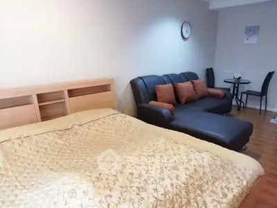 Cozy bedroom with stylish sofa and elegant decor