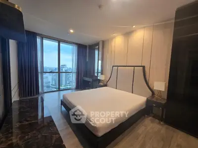 Luxurious bedroom with city view and elegant furnishings in modern apartment