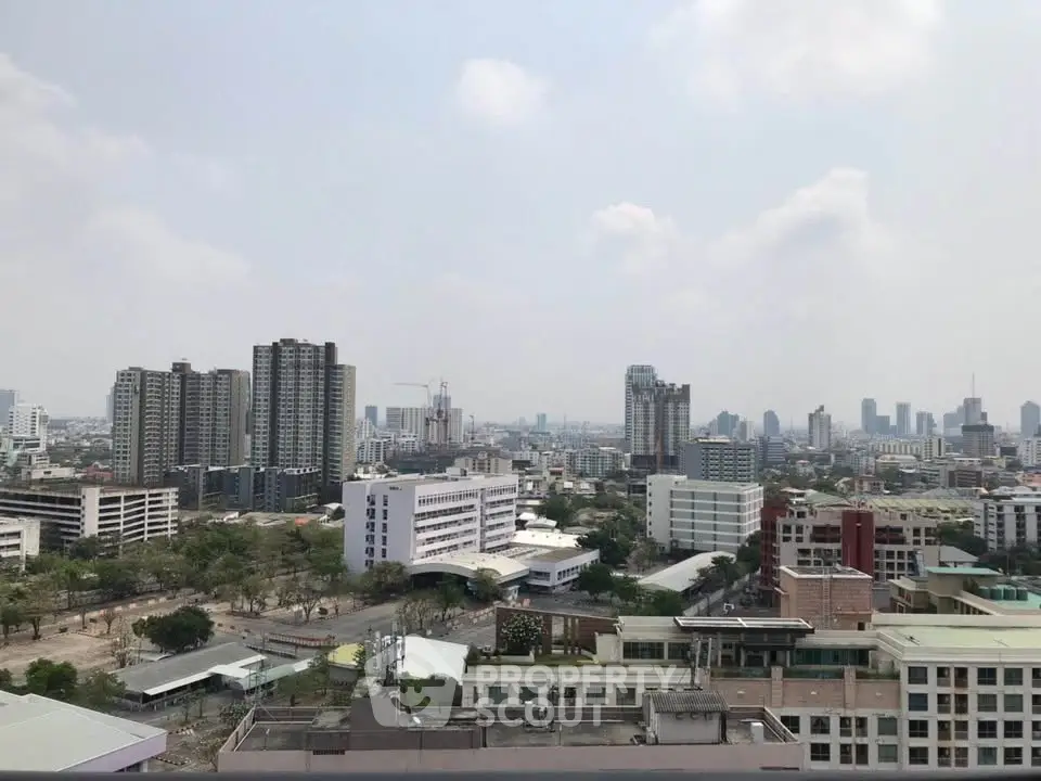 Stunning cityscape view from a high-rise building showcasing urban skyline and architecture.