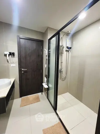 Modern bathroom with glass shower enclosure and sleek design