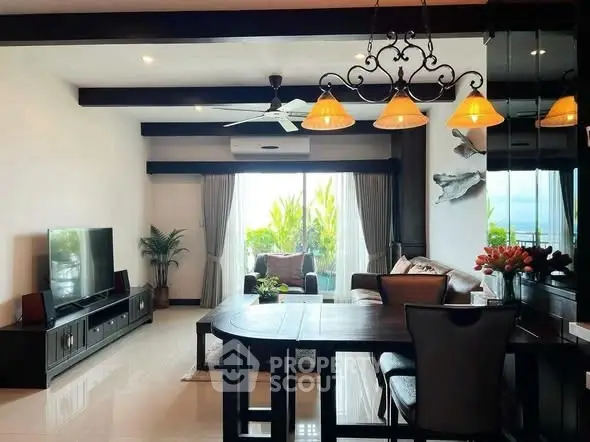 Spacious living room with elegant decor and large window view.