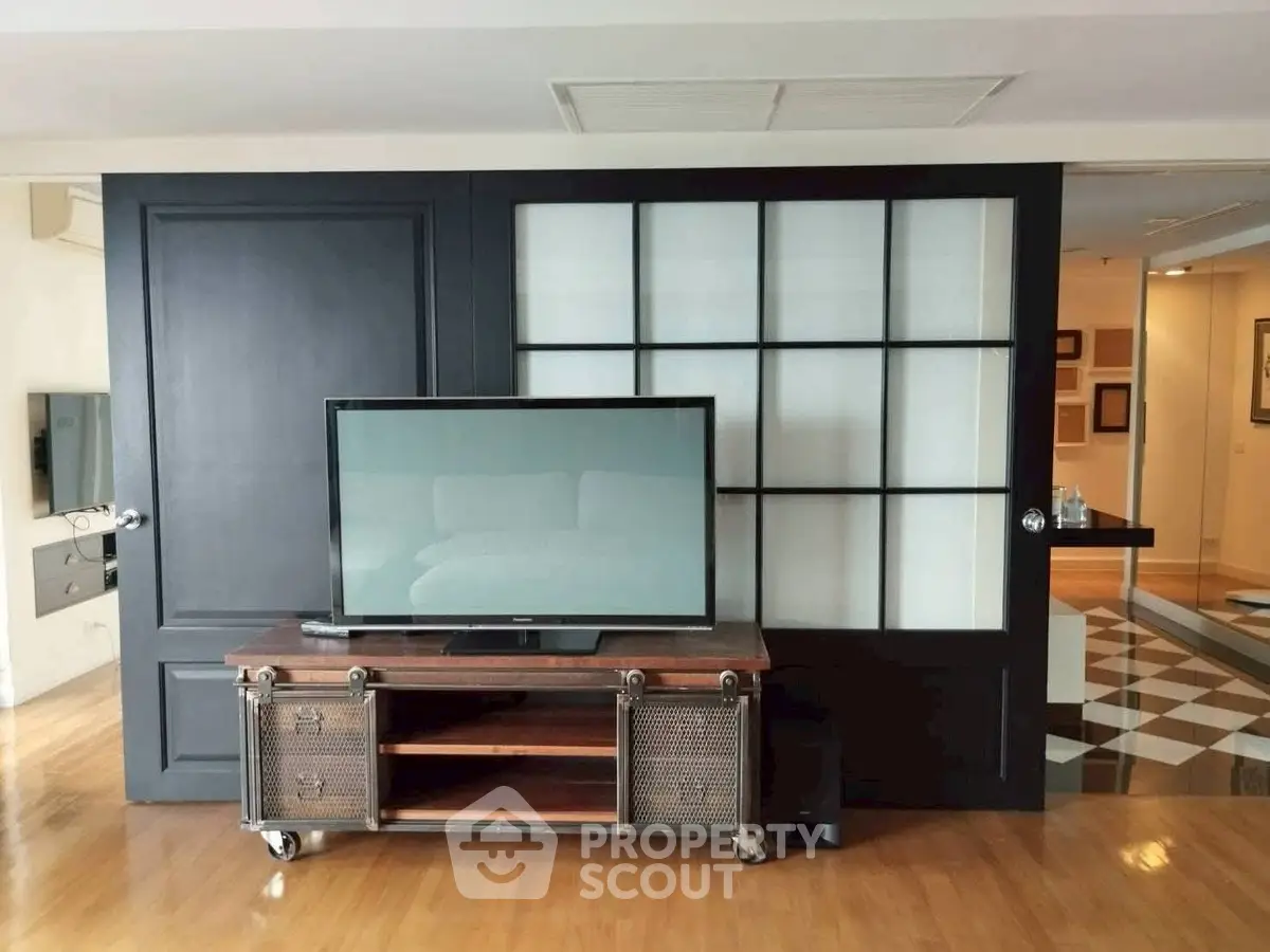 Stylish living room with modern TV stand and sliding glass doors