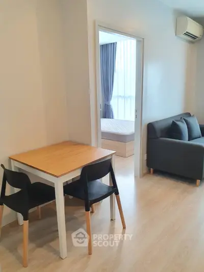 Modern apartment interior with cozy living area and dining space