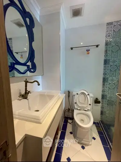 Charming bathroom with elegant blue accents and modern fixtures