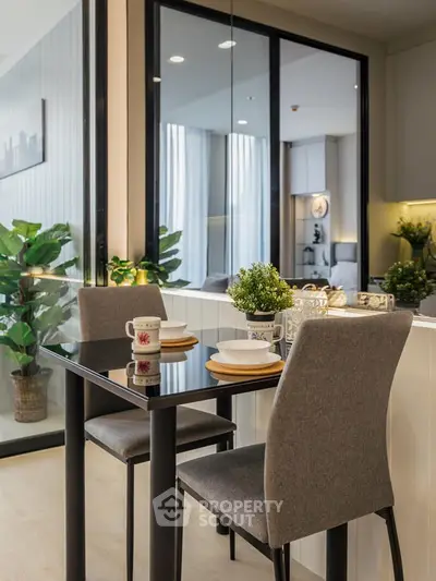Modern dining area with sleek table and chairs, adjacent to a cozy living space, perfect for urban living.