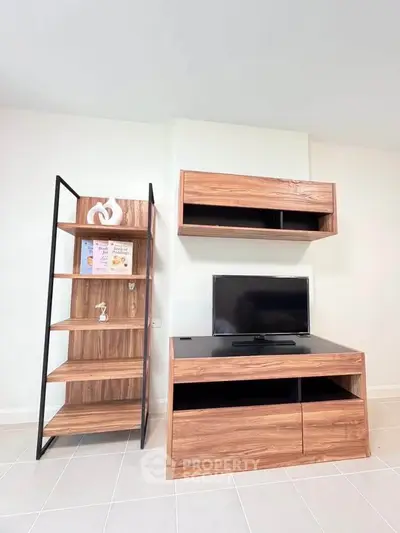 Modern living room with stylish wooden TV stand and shelving unit