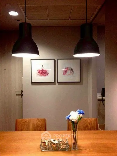 Stylish dining area with modern lighting and elegant decor