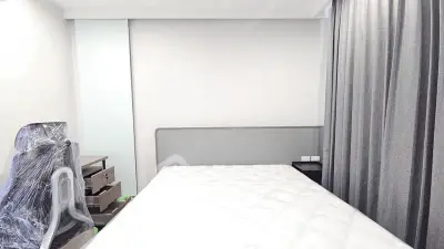 Modern bedroom with minimalist design and large window curtains