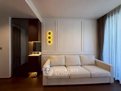 Modern living room with elegant sofa and ambient lighting, featuring floor-to-ceiling curtains and sleek wall paneling.