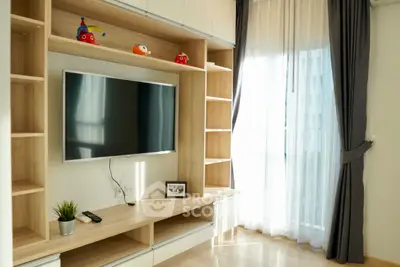 Modern living room with built-in TV unit and large window