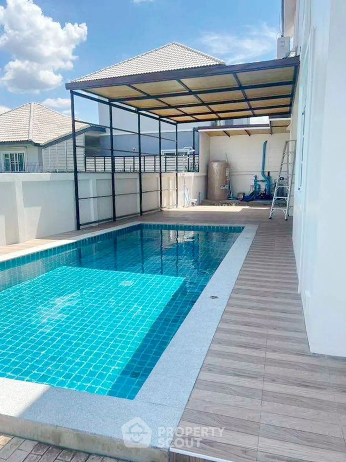 Stunning private pool with modern covered area in a luxurious residential property.