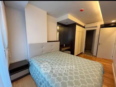 Modern bedroom with stylish decor and ample storage in a contemporary apartment.