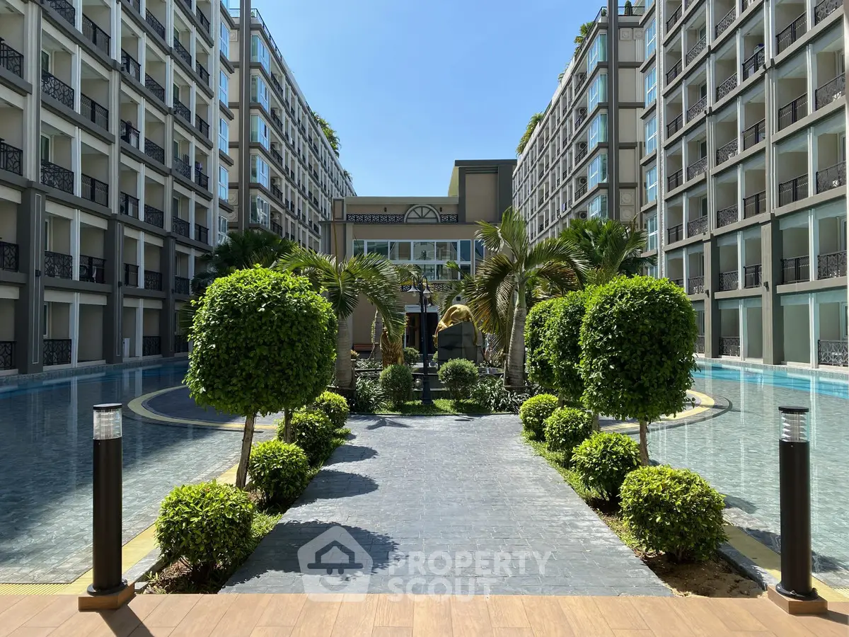 Luxurious modern apartment complex with stunning pool and lush landscaping