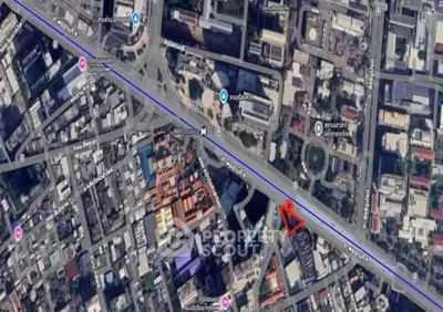 Aerial view of urban real estate location with streets and buildings.
