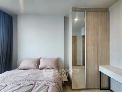 Modern bedroom with cozy bedding and sleek wardrobe design