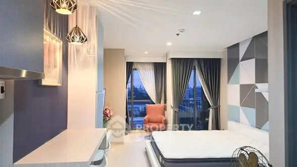 Modern bedroom with stylish decor and large windows offering a scenic view.