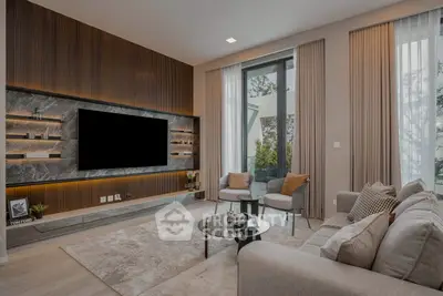 Luxurious modern living room with stylish decor and large TV, perfect for relaxation.