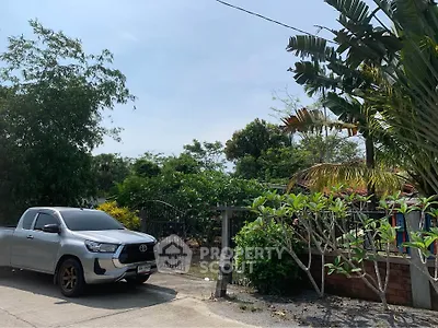 Charming suburban property with lush greenery and secure gated entrance, perfect for tranquil living.