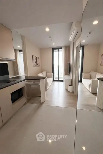 Modern living room with sleek design and large windows for natural light