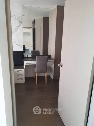 Modern study nook with sleek desk and chair in a stylish apartment