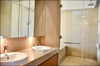 Luxurious modern bathroom with dual sinks and spacious shower area