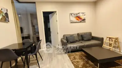 Modern living room with sleek furniture and stylish decor in a contemporary apartment.