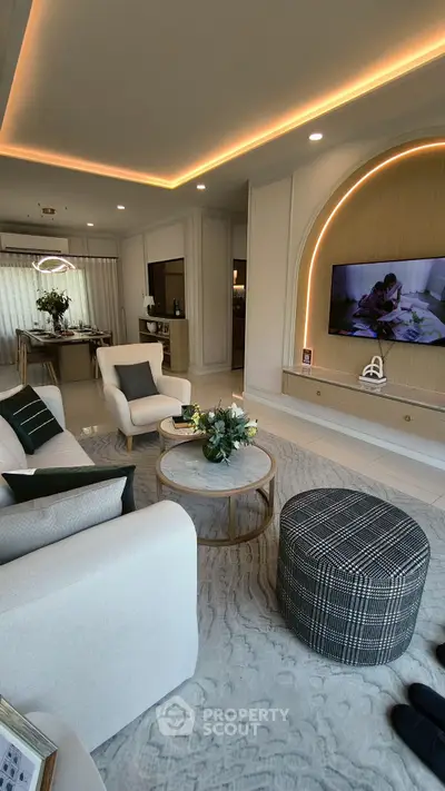Luxurious living room with modern decor, elegant lighting, and stylish furniture, perfect for relaxation and entertainment.