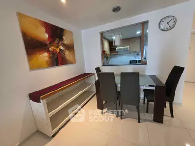 Modern dining area with stylish art and open kitchen view
