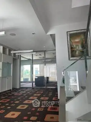 Modern office lobby with stylish carpet and glass staircase