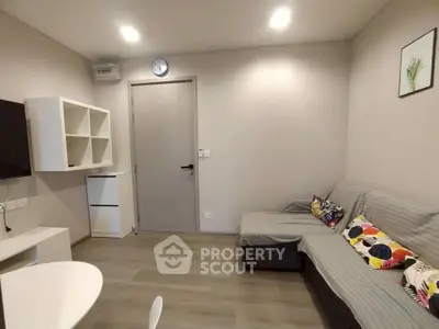 Cozy modern living room with stylish decor and comfortable seating in a contemporary apartment.