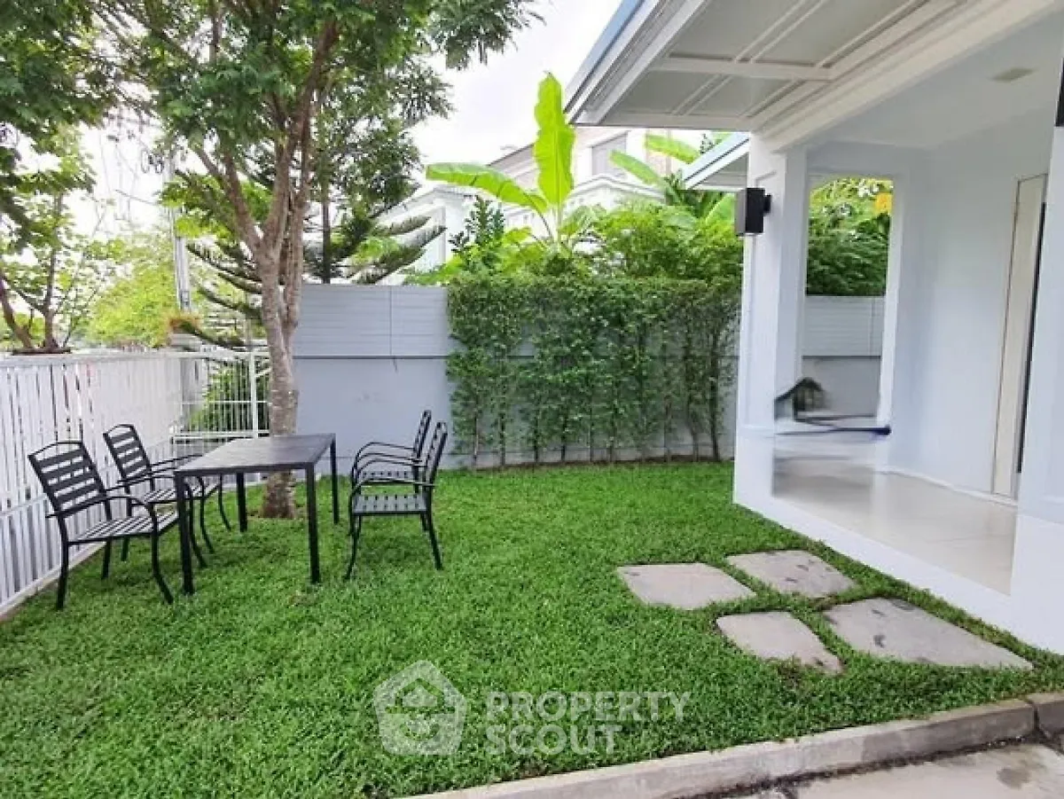 Charming garden area with outdoor seating in a modern home