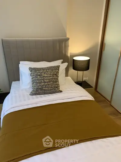 Cozy bedroom with stylish decor and warm lighting