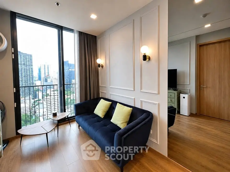 Modern living room with city view and stylish decor in high-rise apartment