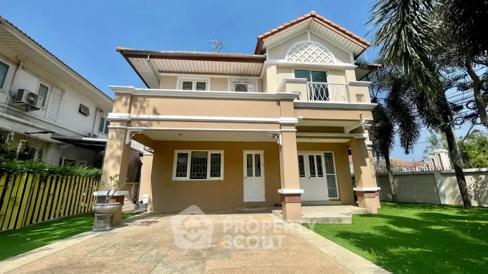 Charming two-story house with spacious driveway and lush garden in a serene neighborhood.