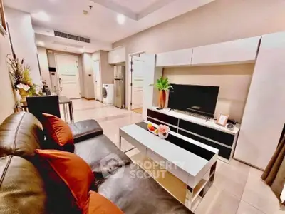 Modern living room with sleek furniture and open layout, perfect for urban living.